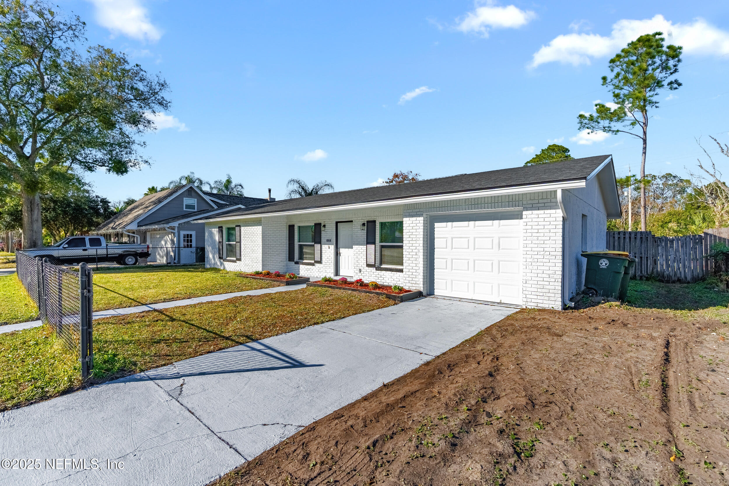 3631 North Ride Drive Jacksonville, FL 32223 - Photo 2 of 30 a house with trees in front of it