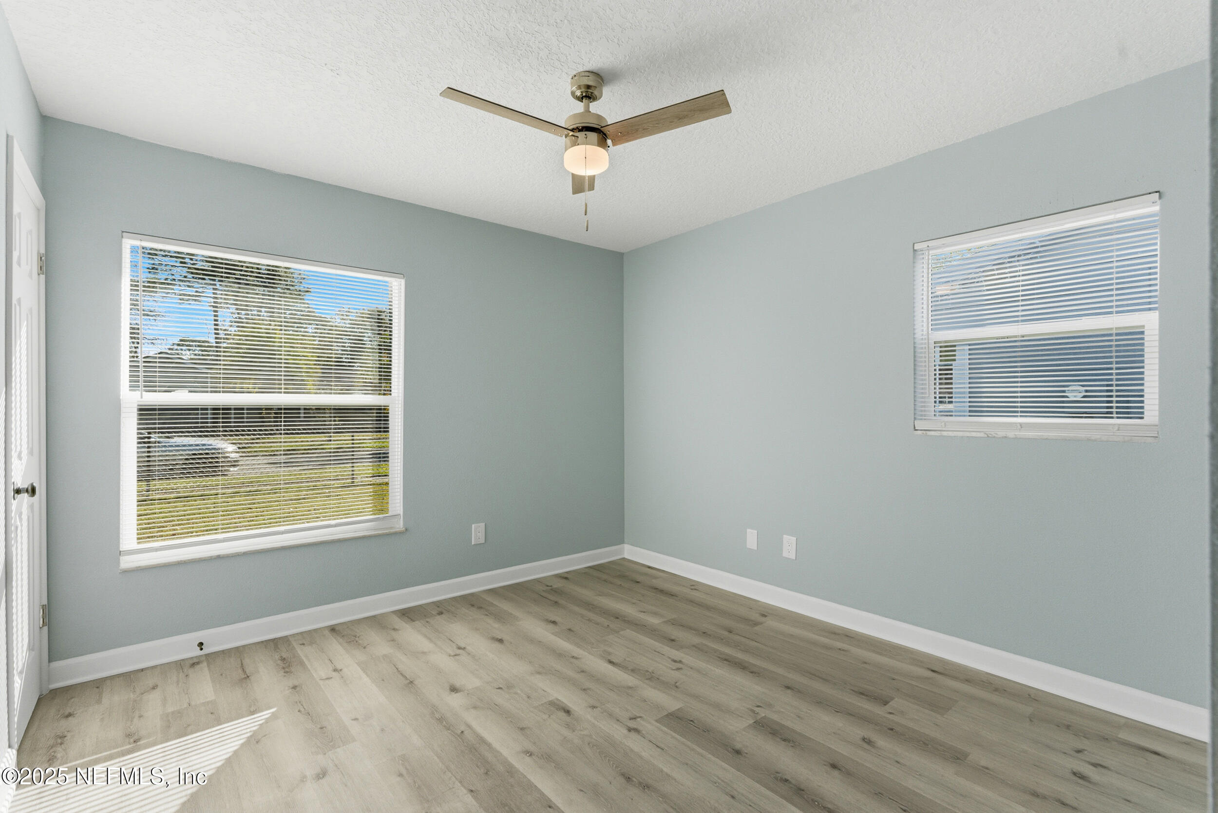 3631 North Ride Drive Jacksonville, FL 32223 - Photo 24 of 30 a view of an empty room with wooden floor and a window