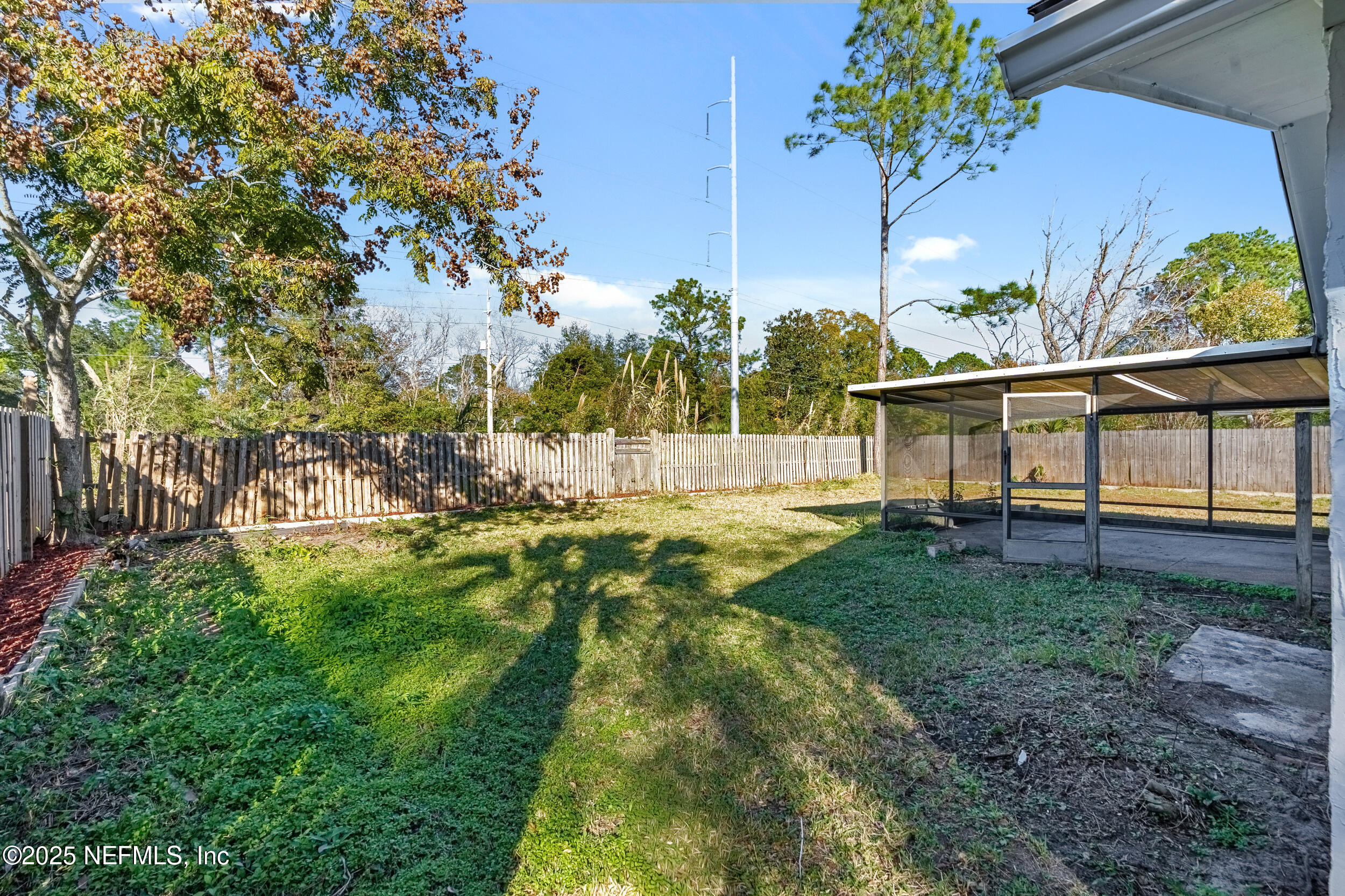 3631 North Ride Drive Jacksonville, FL 32223 - Photo 27 of 30 a view of backyard with a garden and entertaining space
