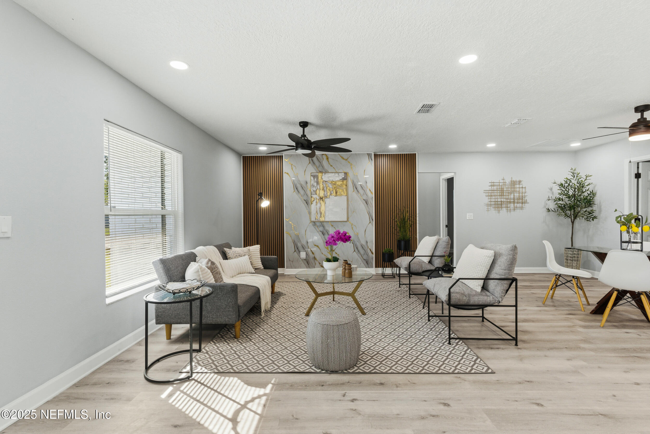 3631 North Ride Drive Jacksonville, FL 32223 - Photo 3 of 30 a living room with furniture and a chandelier
