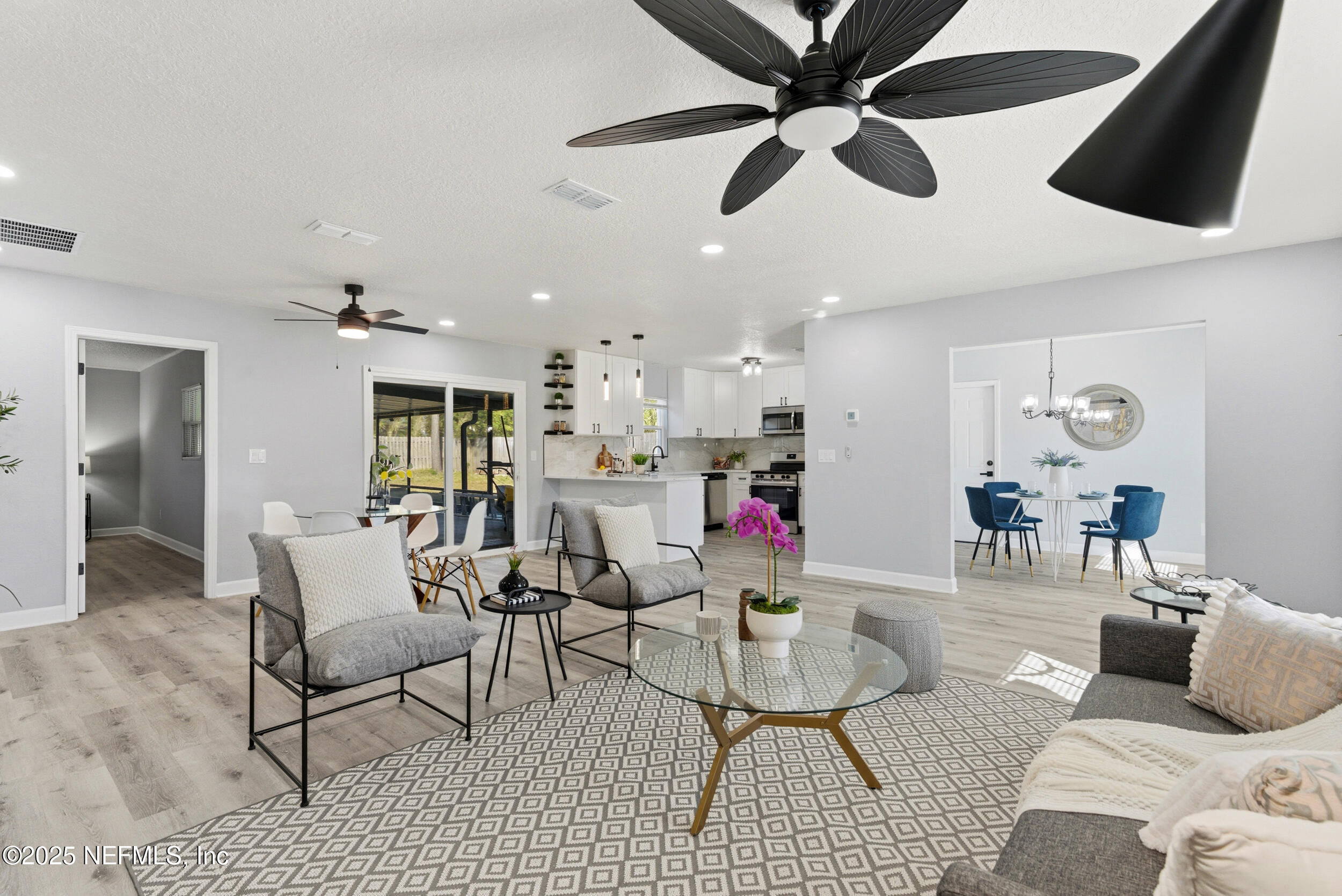 3631 North Ride Drive Jacksonville, FL 32223 - Photo 5 of 30 a living room with furniture and a ceiling fan