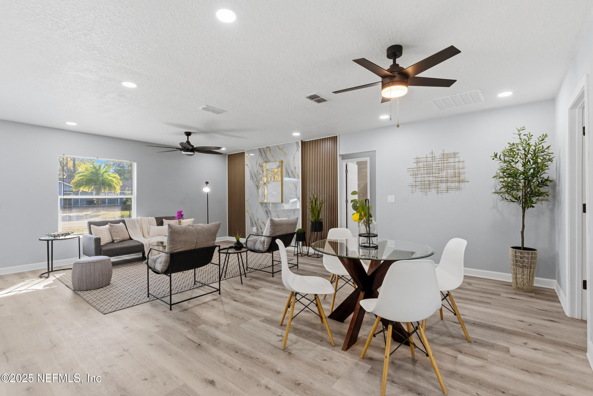 3631 North Ride Drive Jacksonville, FL 32223 - Photo 6 of 30 a living room with furniture and a potted plant