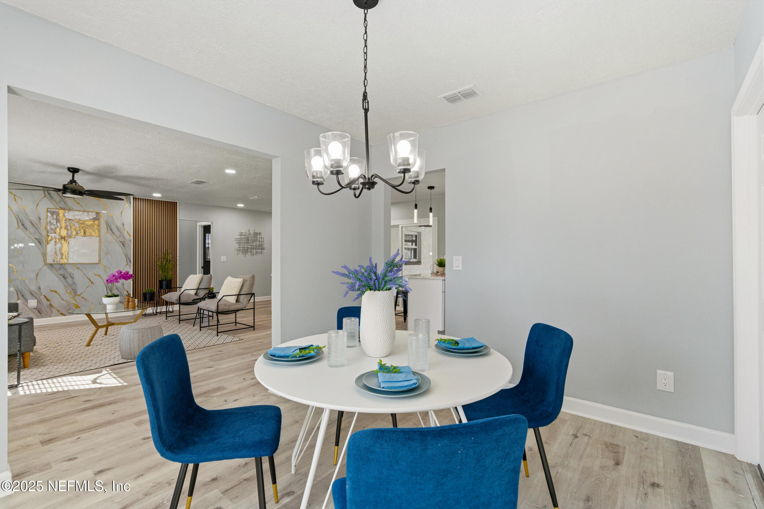 3631 North Ride Drive Jacksonville, FL 32223 - Photo 10 of 30 a view of a dining room with furniture and wooden floor