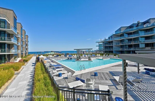 a view of a chairs and tables in the balcony