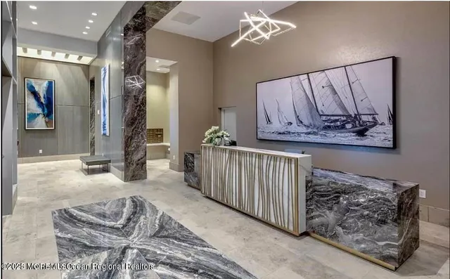 a bedroom with furniture and a large mirror