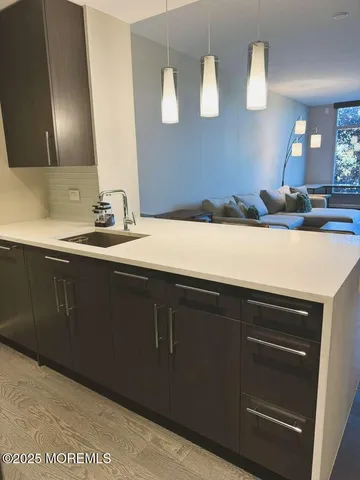 a spacious bedroom with a bed and large flat screen tv