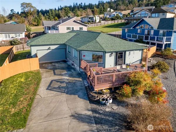 an aerial view of a house with a yard
