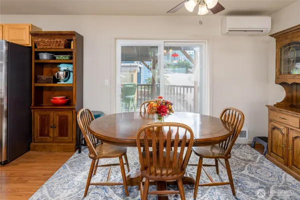 a view of a dining room with furniture and chandelier