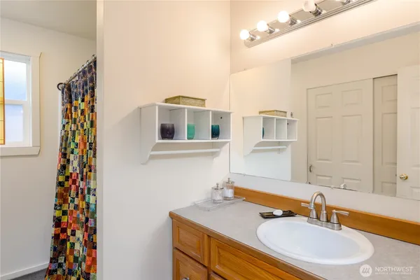 a bathroom with a sink and a mirror