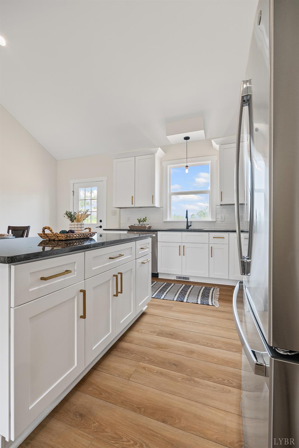 1 Kentmoor Farm Road Madison Heights, VA 24572 - Photo 14 of 38 a kitchen with stainless steel appliances granite countertop a refrigerator sink and white cabinets