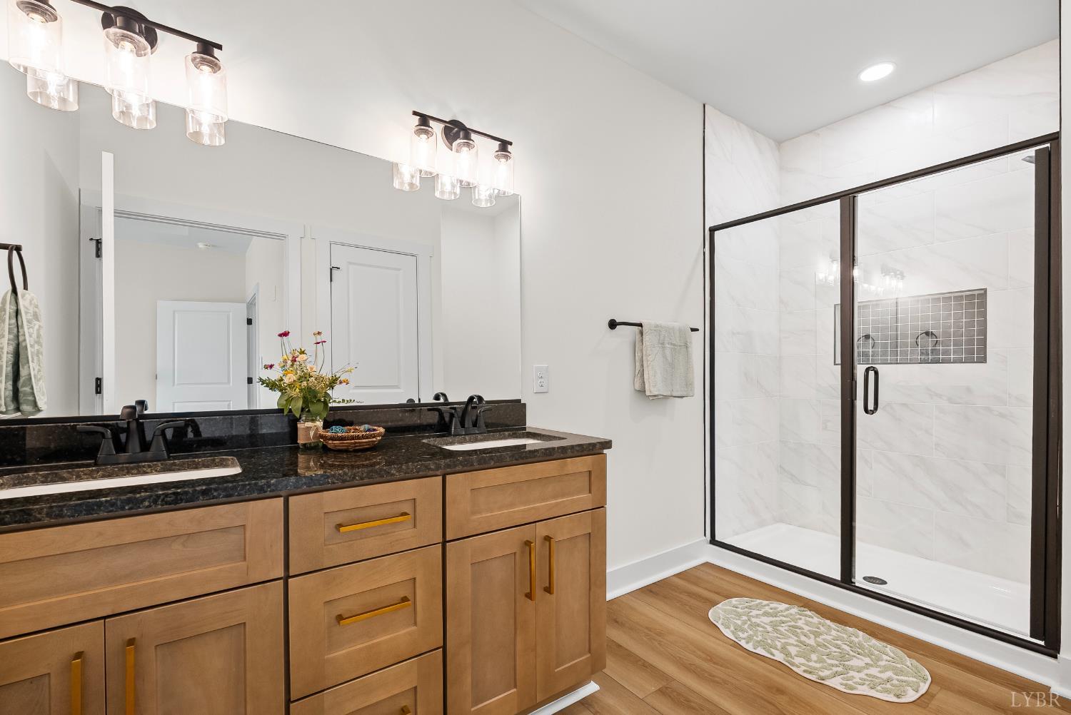 1 Kentmoor Farm Road Madison Heights, VA 24572 - Photo 23 of 38 a bathroom with a double vanity sink and mirror