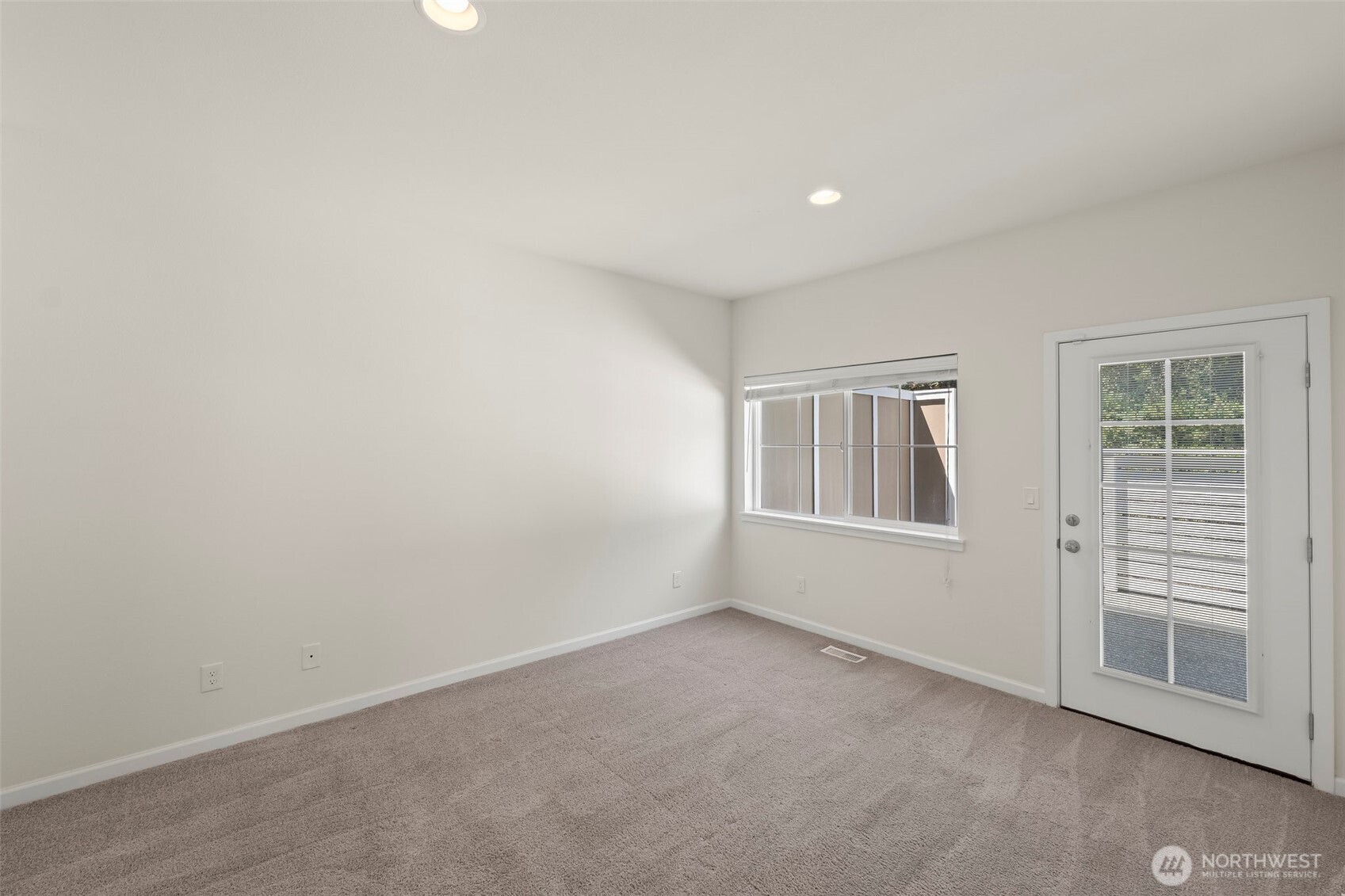 1080 East Old Ranch Road, Unit A1A2 Allyn, WA 98524 - Photo 17 of 35 an empty room with windows
