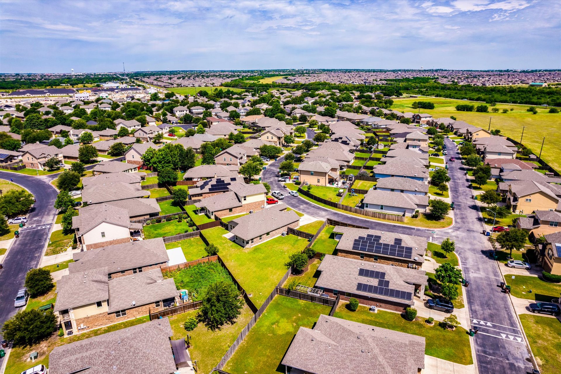 16829 Ruggio Road Pflugerville, TX 78660 - Photo 31 of 40 an aerial view of residential houses with outdoor space and trees