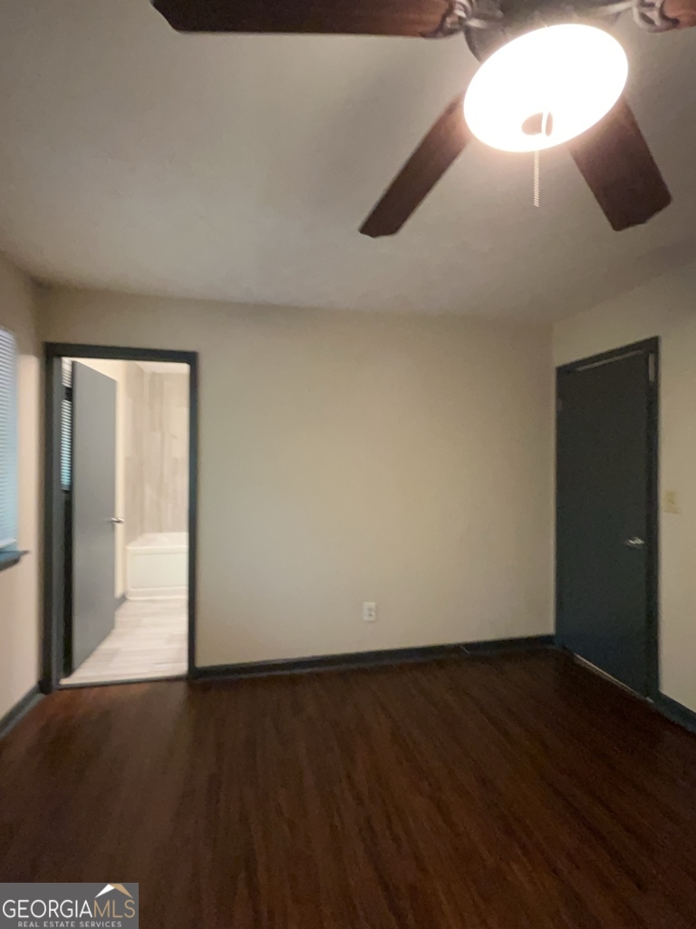 1265 Herrington Road Lawrenceville, GA 30044 - Photo 21 of 52 an empty room with wooden floor and windows