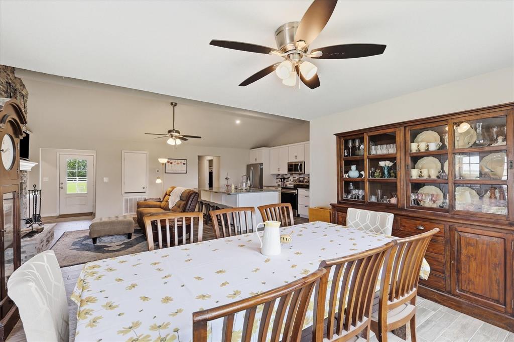 110 Highview Road Ennis, TX 75119 - Photo 11 of 40 Expansive dining area featuring wood-finish flooring and a built-in display hutch