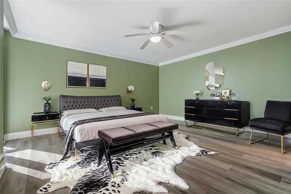 2413 Bayshore Boulevard, Unit 1004 Tampa, FL 33629 - Photo 23 of 36 a bedroom with a bed and a chandelier