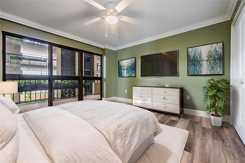 2413 Bayshore Boulevard, Unit 1004 Tampa, FL 33629 - Photo 29 of 36 a bedroom with a bed window and a flat tv screen