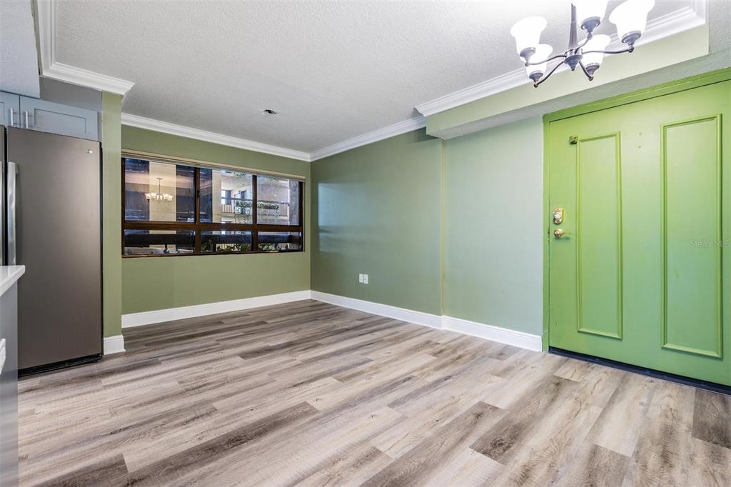 2413 Bayshore Boulevard, Unit 1004 Tampa, FL 33629 - Photo 4 of 36 a view of empty room with kitchen and window