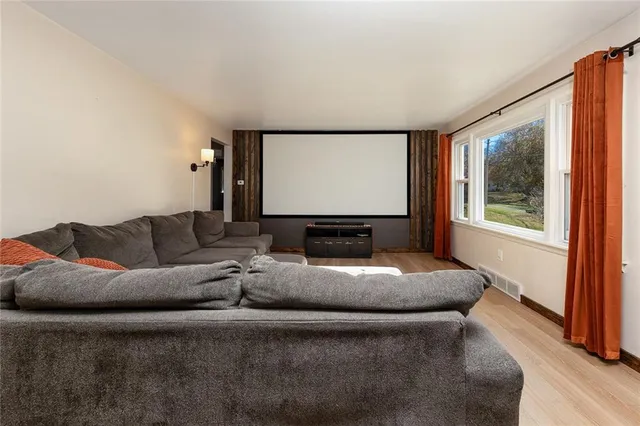 a bedroom with furniture and a window