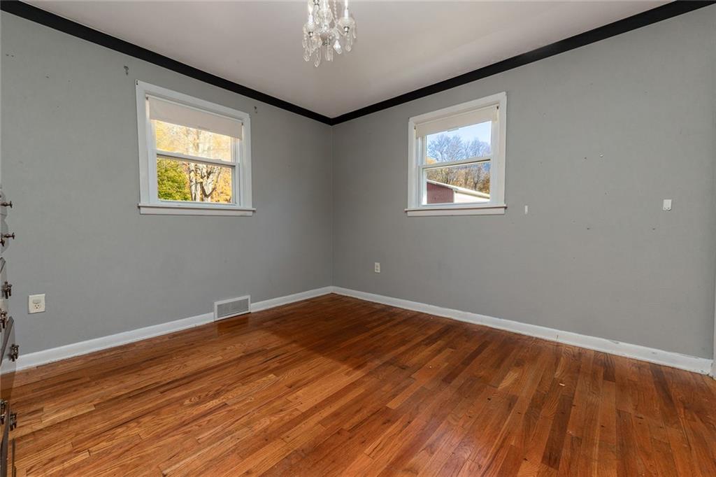 10 Fredonia Road Greenville, PA 16125 - Photo 19 of 28 a view of an empty room with wooden floor and a window