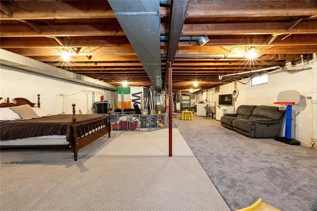 a kitchen with stainless steel appliances kitchen island granite countertop a stove a sink and a microwave