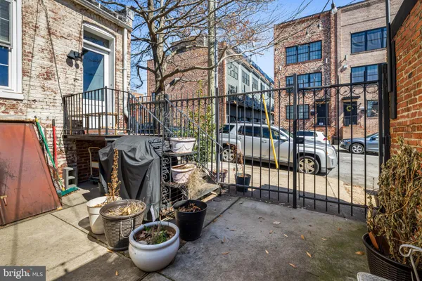 a view of a patio with couches and potted plants