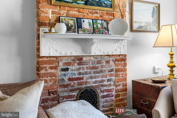 a room with a fireplace and painted walls