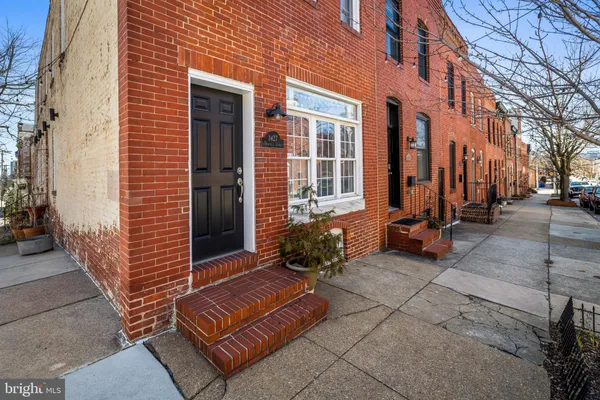 a view of a brick buildings with many windows