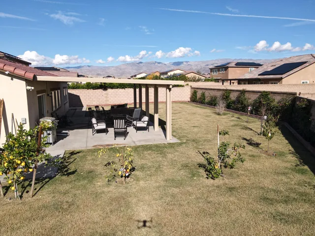 a view of a swimming pool with furniture