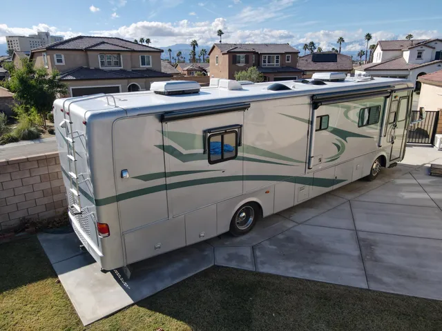 a view of a white house with a sink and washer