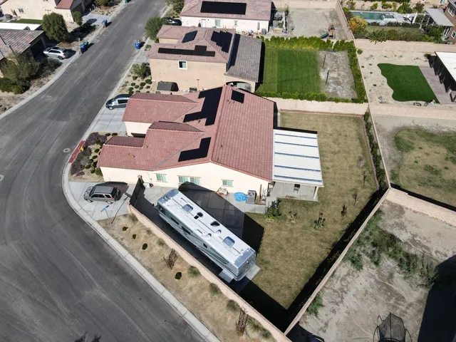 an aerial view of a residential houses with outdoor space