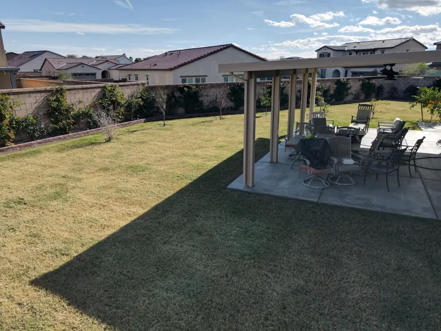 a view of a swimming pool with a patio