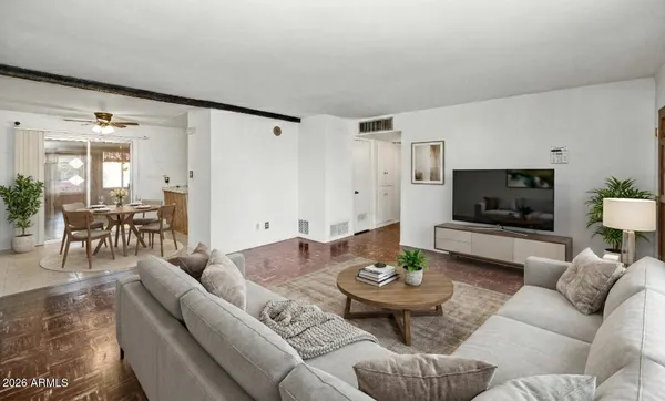 a living room with furniture and a flat screen tv