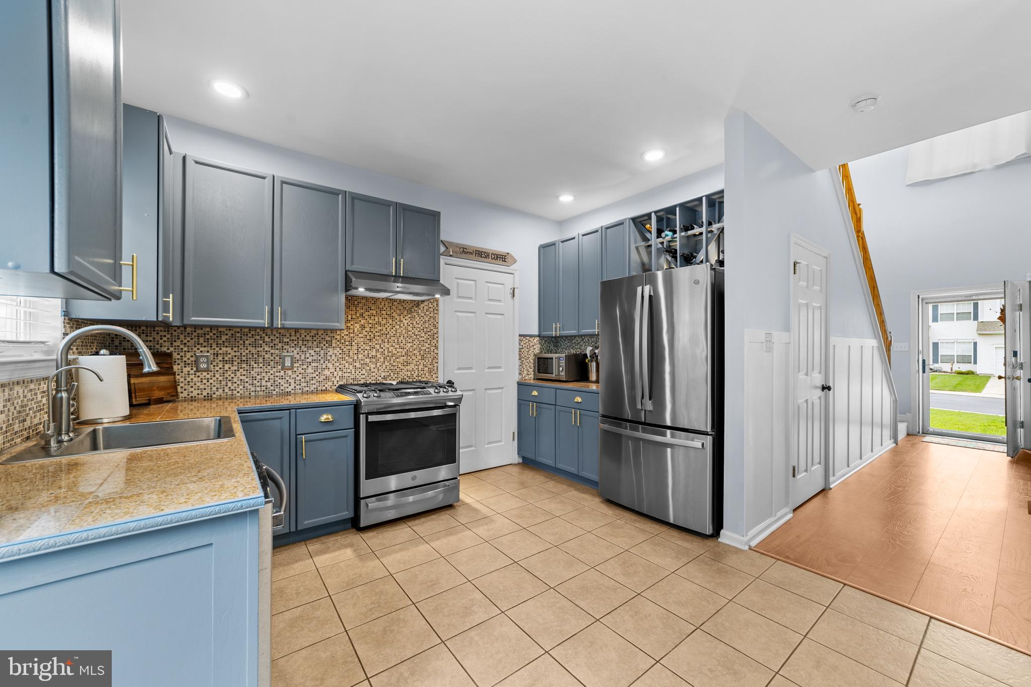 32 Windingbrook Road Bordentown, NJ 08505 - Photo 10 of 30 Modern kitchen with stylish blue cabinetry.