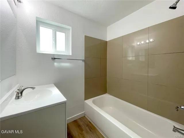 a view of a bathroom from a hallway