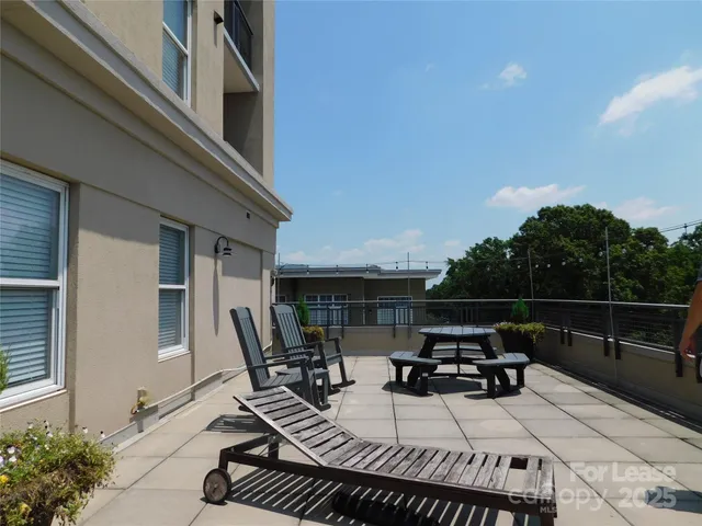 a view of roof deck with seating space