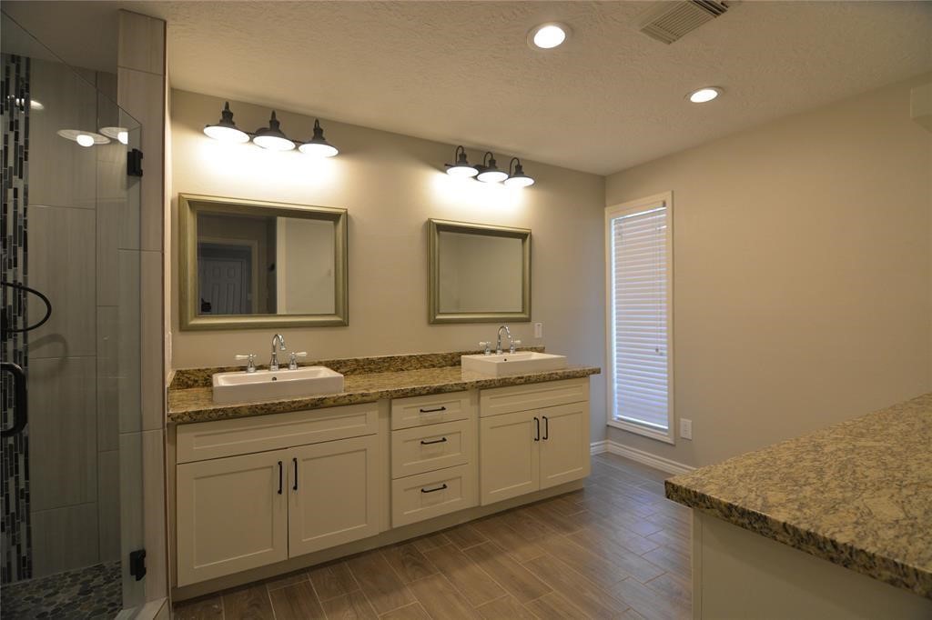 19118 Challe Circle West Spring, TX 77373 - Photo 12 of 21 a bathroom with a double vanity sink and a mirror