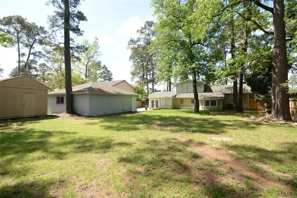 a view of a house with a backyard