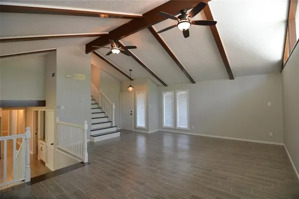 a view of an entryway with wooden floor