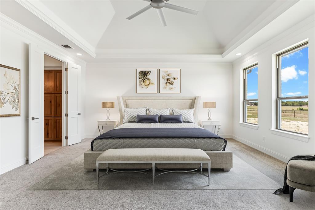 151 Ava Rose Lane Waxahachie, TX 75167 - Photo 18 of 32 a bedroom with a bed and a couch