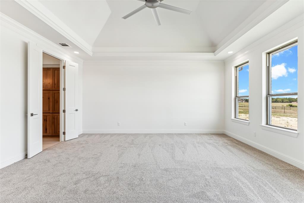151 Ava Rose Lane Waxahachie, TX 75167 - Photo 19 of 32 an empty room with windows and fan