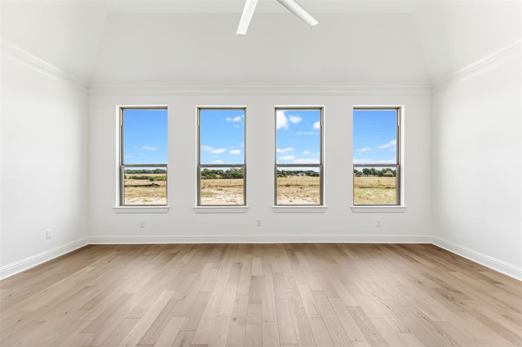 151 Ava Rose Lane Waxahachie, TX 75167 - Photo 24 of 32 an empty room with wooden floor and windows