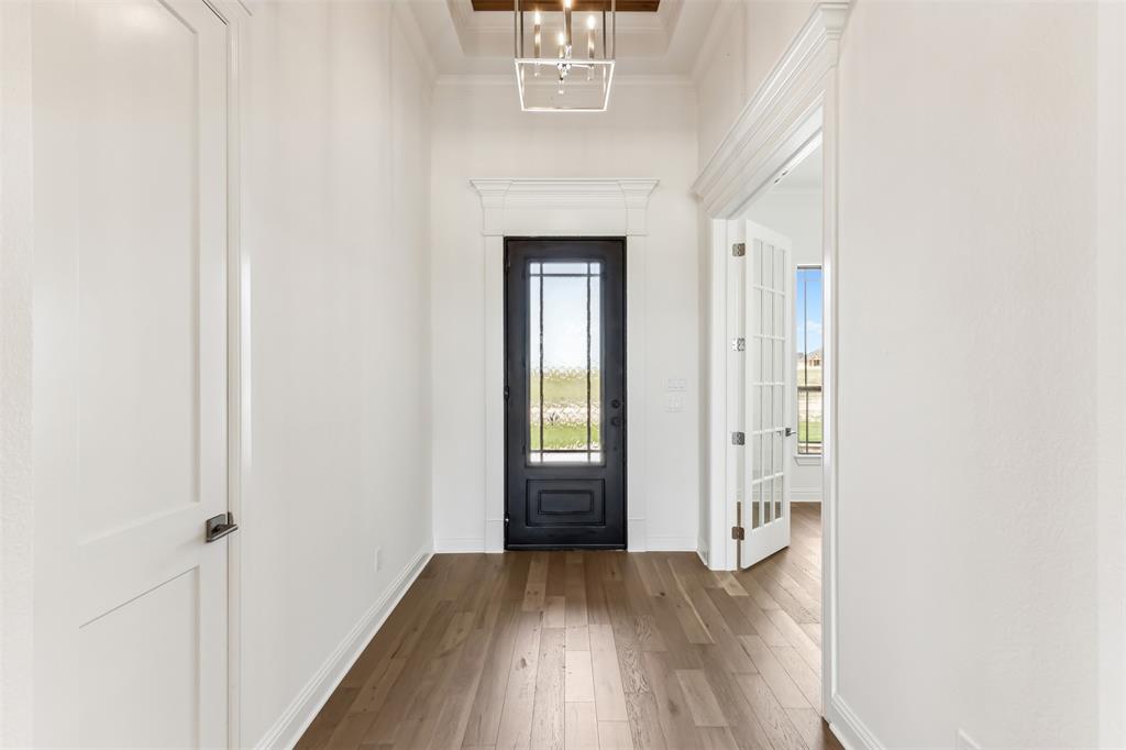151 Ava Rose Lane Waxahachie, TX 75167 - Photo 6 of 32 a view of an entryway with wooden floor