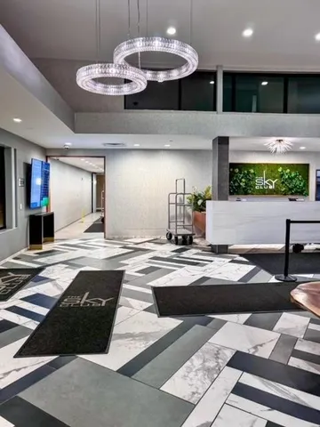 a kitchen with a counter space a sink stainless steel appliances and cabinets