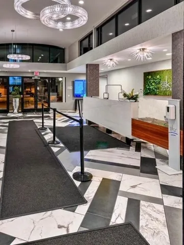 a living room with table tennis and stairs
