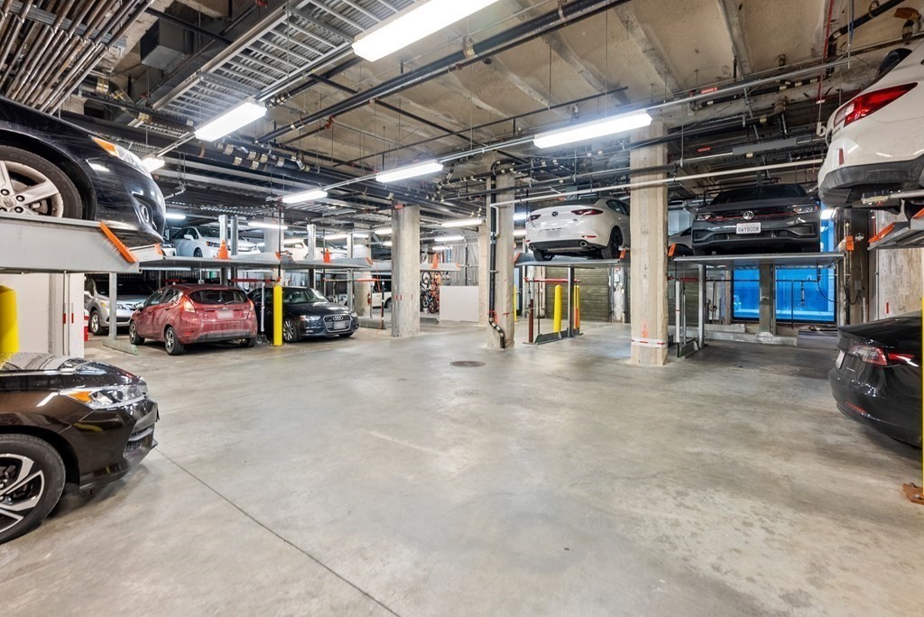 121 Portland Street, Unit 206 Boston, MA 02114 - Photo 32 of 35 a view of parking garage with cars