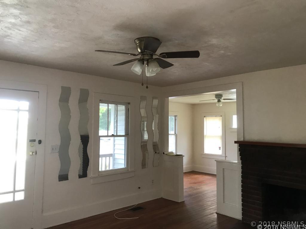 111 Snyder Street Edgewater, FL 32132 - Photo 9 of 16 a view of an empty room with a window