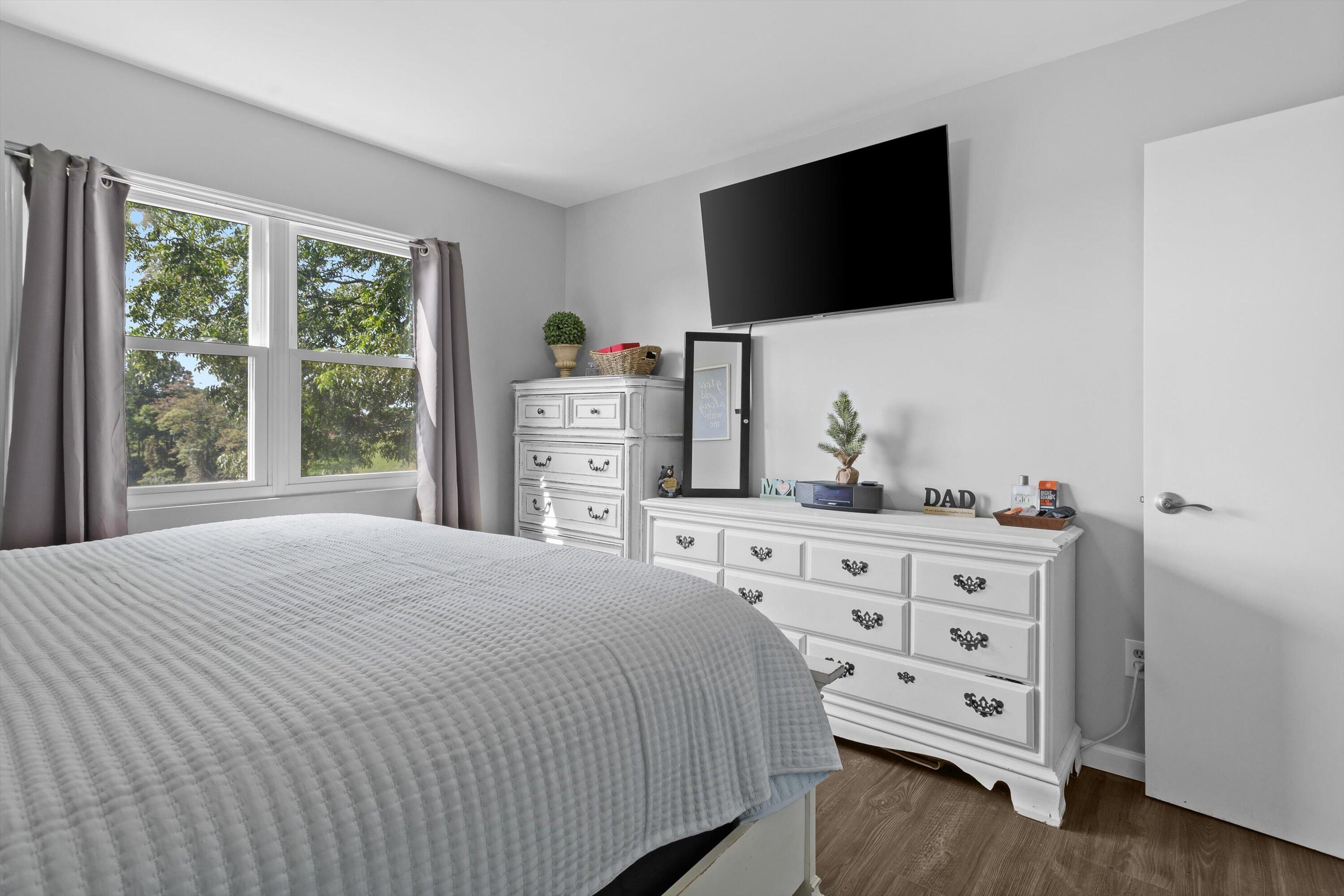 2357 Nemmo Road Vinton, VA 24179 - Photo 24 of 54 a bedroom with a bed and a flat screen tv