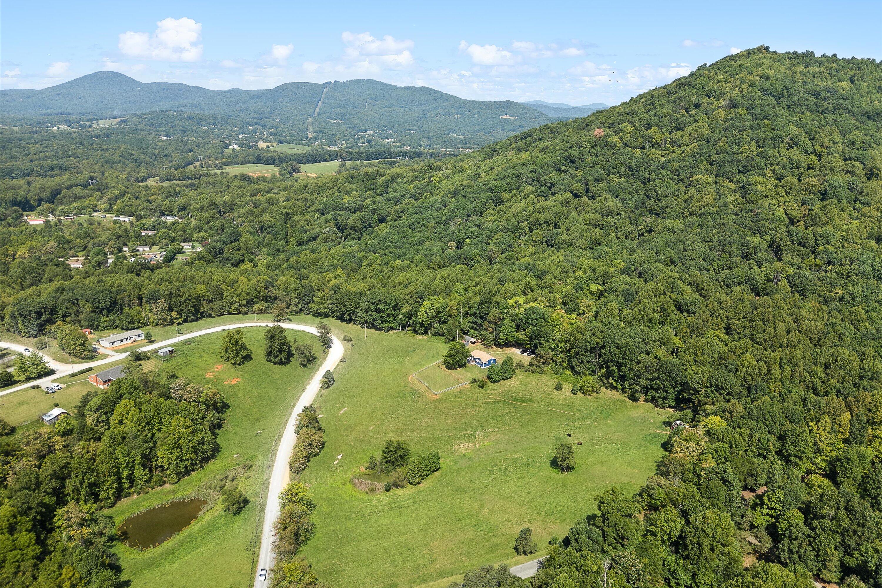 2357 Nemmo Road Vinton, VA 24179 - Photo 50 of 54 a view of a lake with a mountain in the background