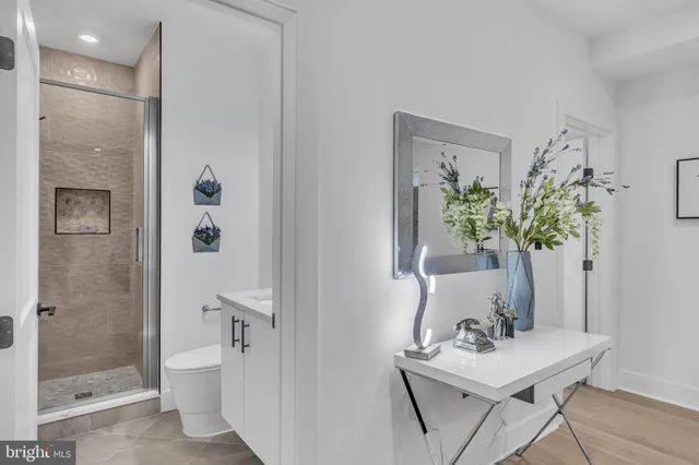 a view of a bathroom with a sink and mirror